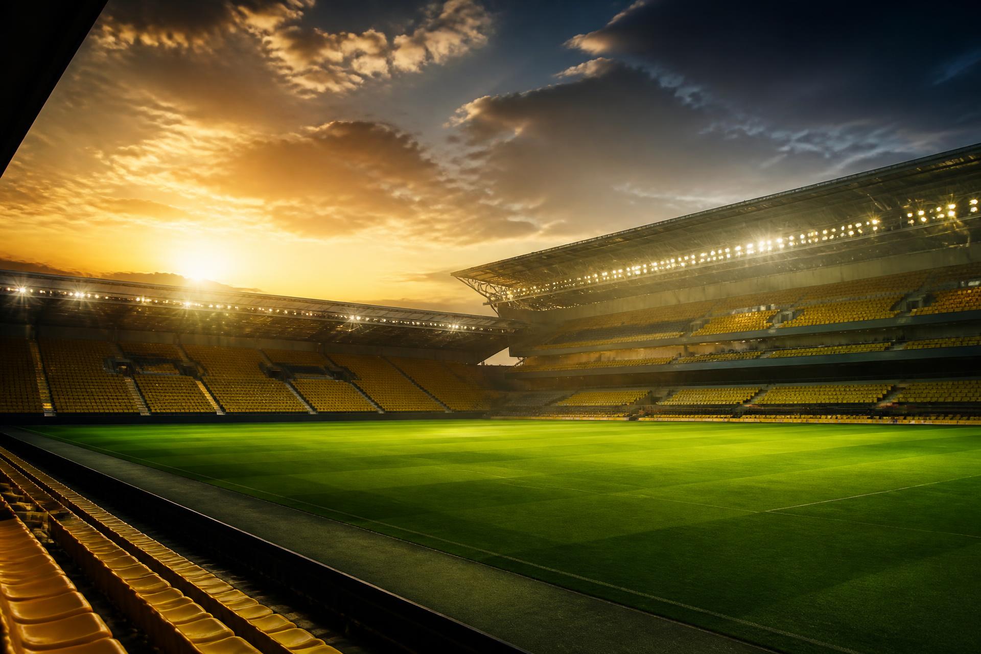Young footballers training at golden hour